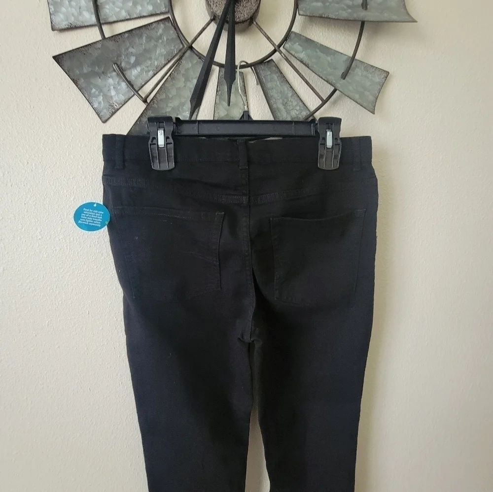 The children place Black super skinny jeans size 16 Husky.